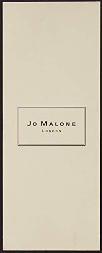 Close-up of Jo Malone Nectarine Blossom & Honey bottle highlighting luminous fruit notes.