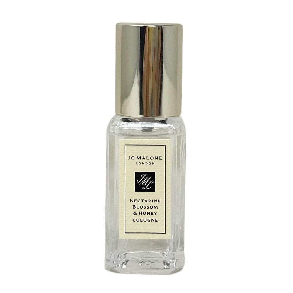 Jo Malone Nectarine Blossom & Honey travel-size cologne bottle for on-the-go freshness and fruity-floral allure.
