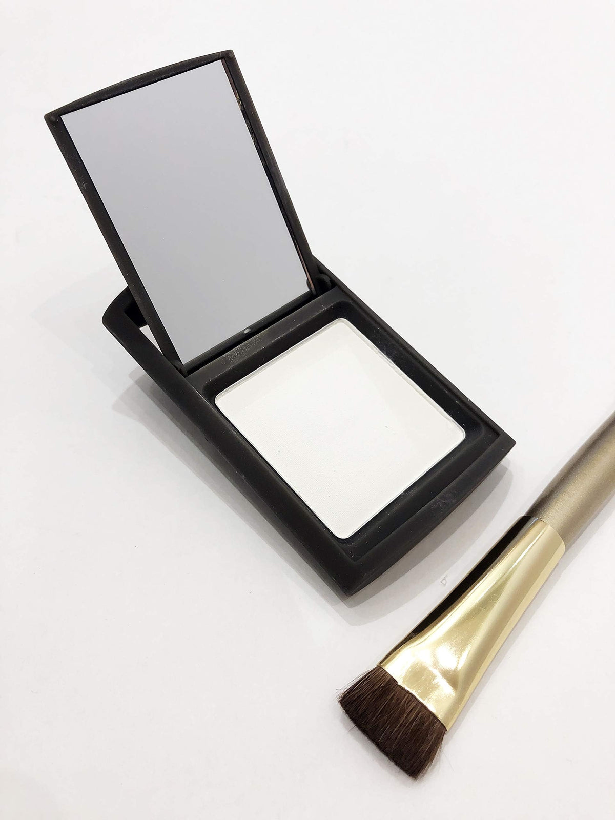 Joan Rivers Beauty Great Hair Day root touch up powder bottle shows instant fuller look.