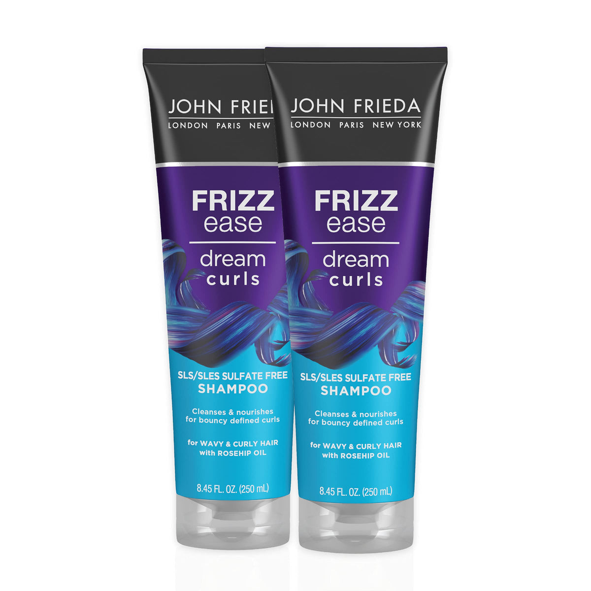 John Frieda Dream Curls Shampoo bottle on sink for defined, frizz-free curls.