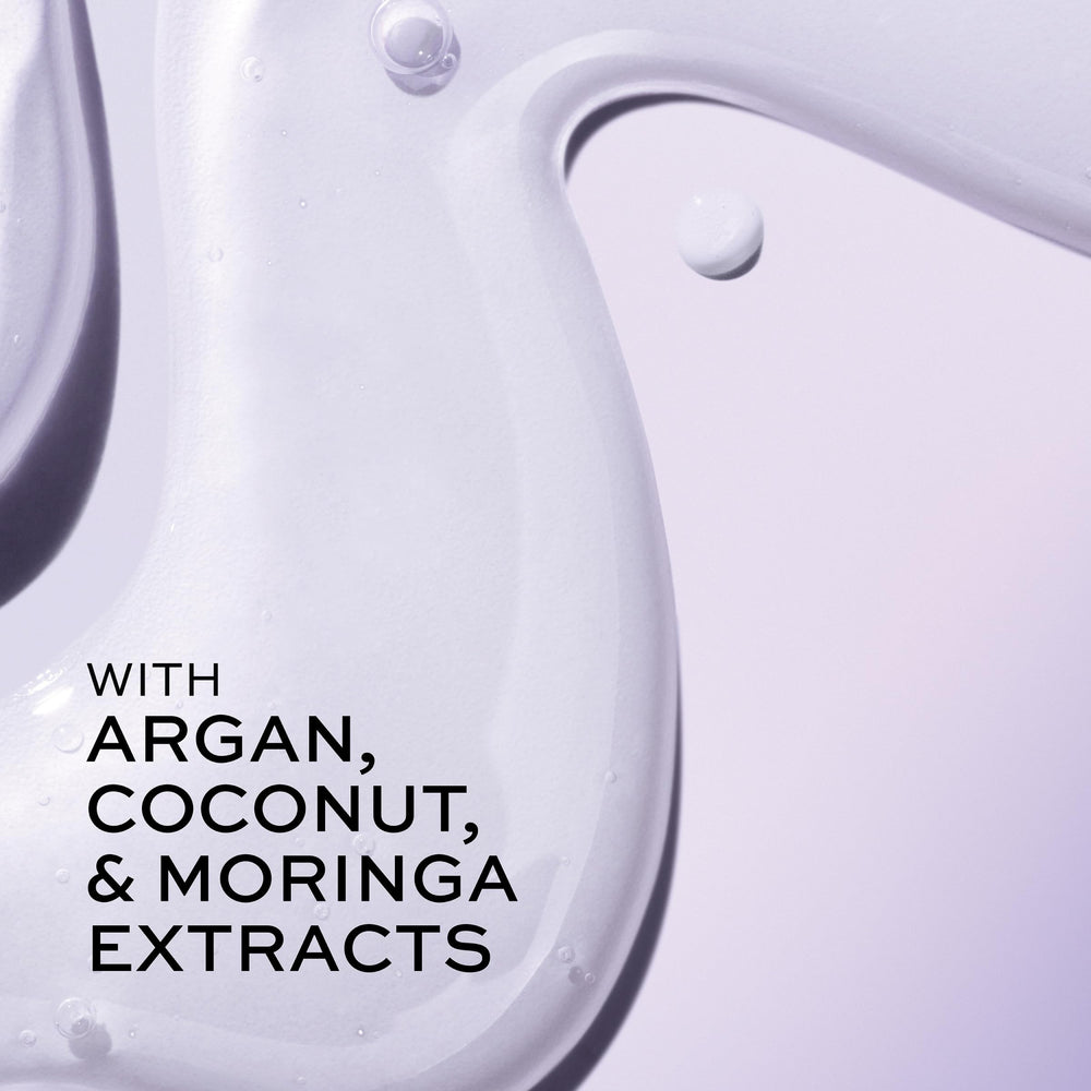 John Frieda Frizz Ease serum on coarse hair for smoother, controlled strands.