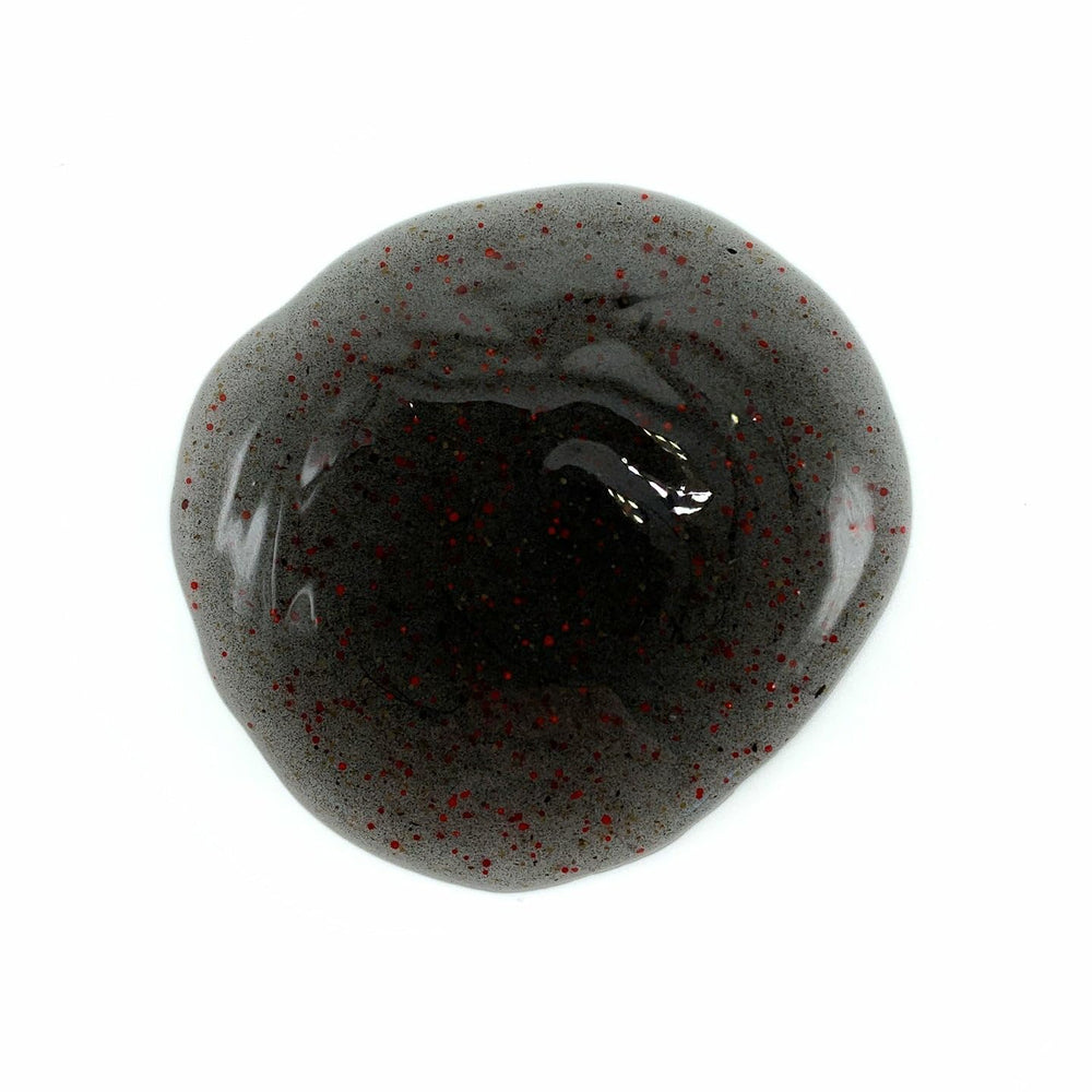 Johnny Slicks Body Wash exfoliating beads close-up promotes smoother, refreshed skin.