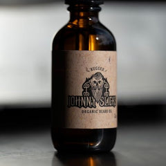 Johnny Slicks Organic Beard Oil dropper shows precise application for even beard coverage.