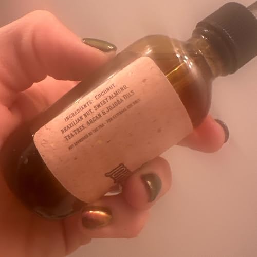 Johnny Slicks Organic Beard Oil ingredients photo highlights tea tree, argan and jojoba oils.