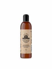 Johnny Slicks Organic Hand Whipped Beard Wash bottle pour highlights refreshing cleanse and invigorating scent.