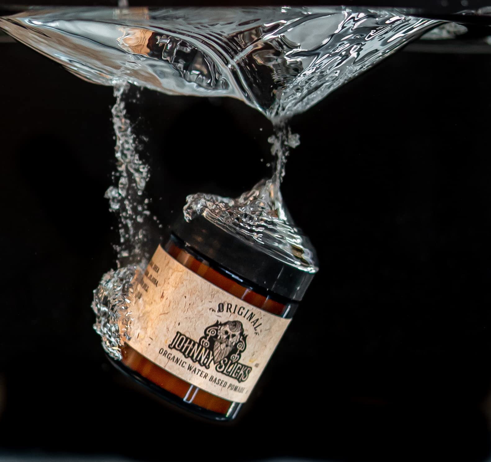 Johnny Slicks pomade applied to hands shows skin-friendly hydration alongside styling