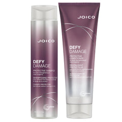 Joico Defy Damage shampoo bottle shows color protection and bond strengthening for color-treated hair.