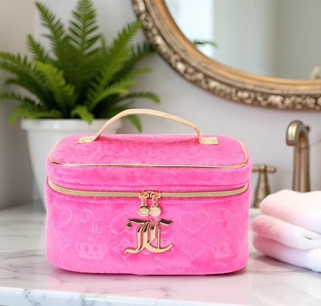 Juicy Couture hot pink makeup bag velour texture detail elevates luxury look.
