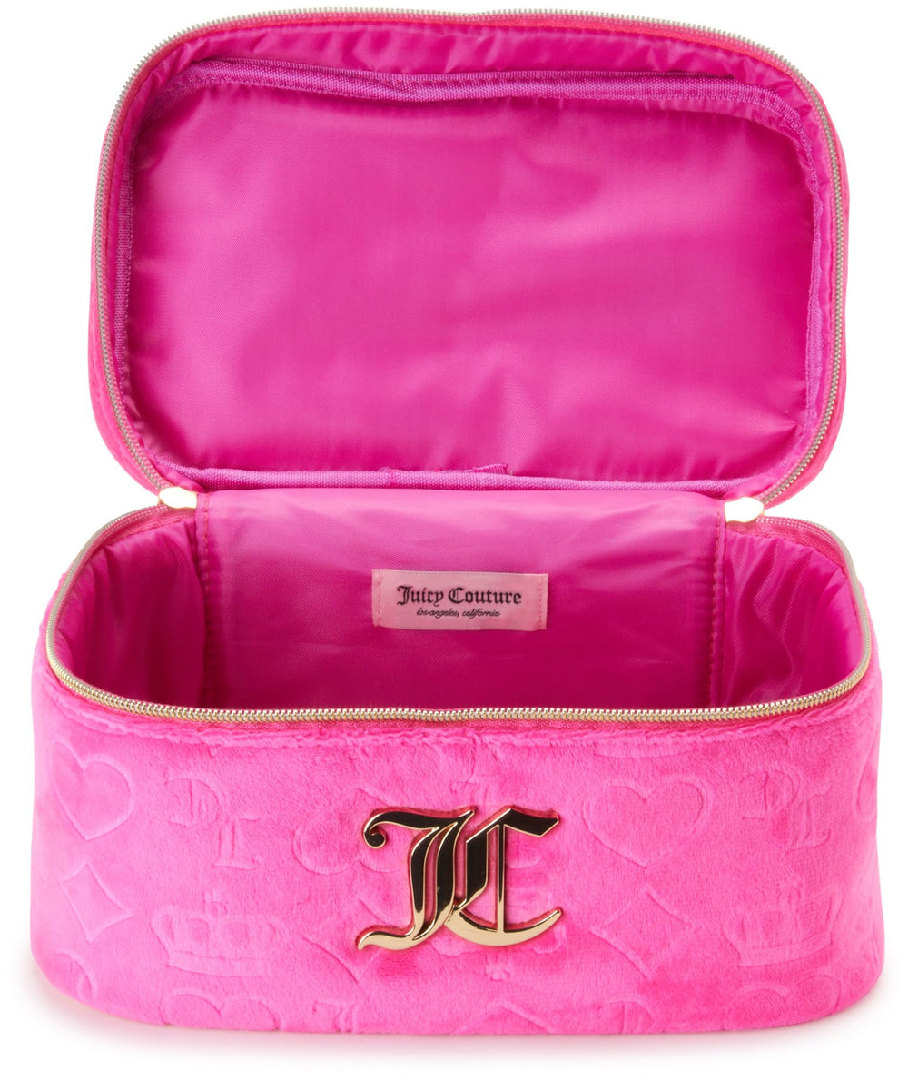 Juicy Couture hot pink makeup bag with brushes ready for quick touch-ups.