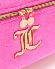Juicy Couture hot pink makeup bag zipper closure keeps contents secure.