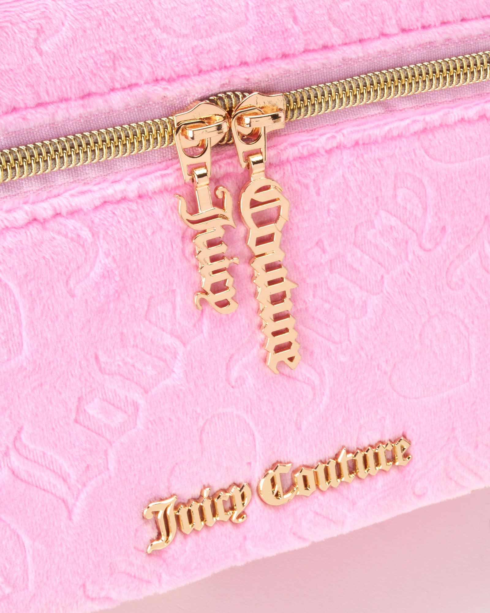 Juicy Couture pink makeup bag brush organizer keeps brushes neatly separated.