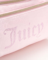 Juicy Couture pink makeup bag hanging strap demonstrates easy access during travel routines.