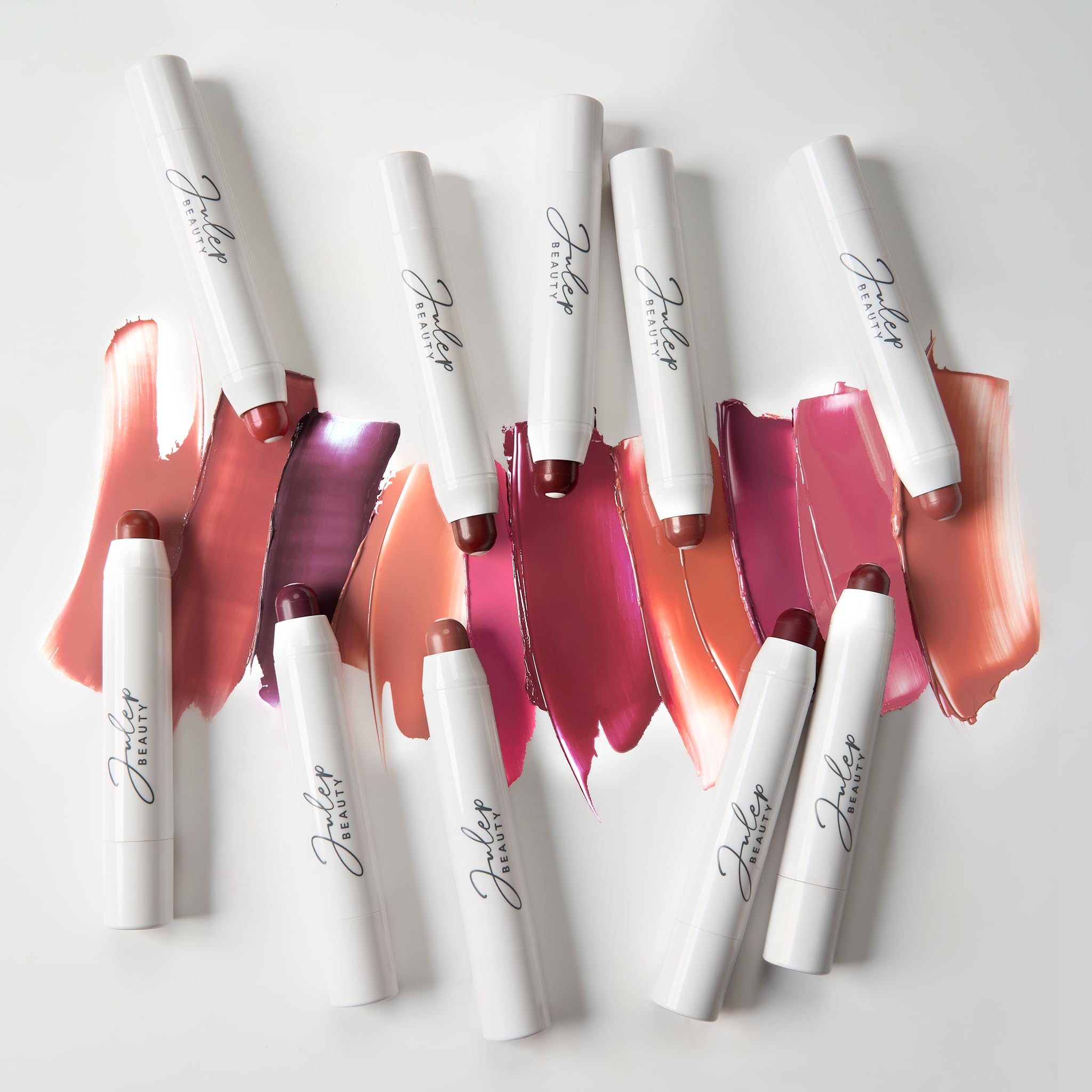 Julep It's Balm Tint Cinnamon Raisin lip balm used in a conscious beauty routine.