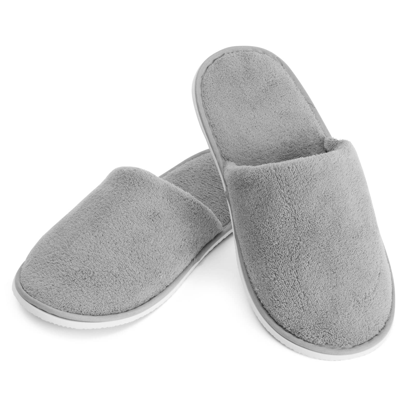 Juvale travel-ready disposable slippers tucked into luggage for comfort