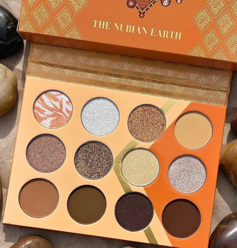 Nubian Earth Palette white shimmer provides bright highlight for inner corners