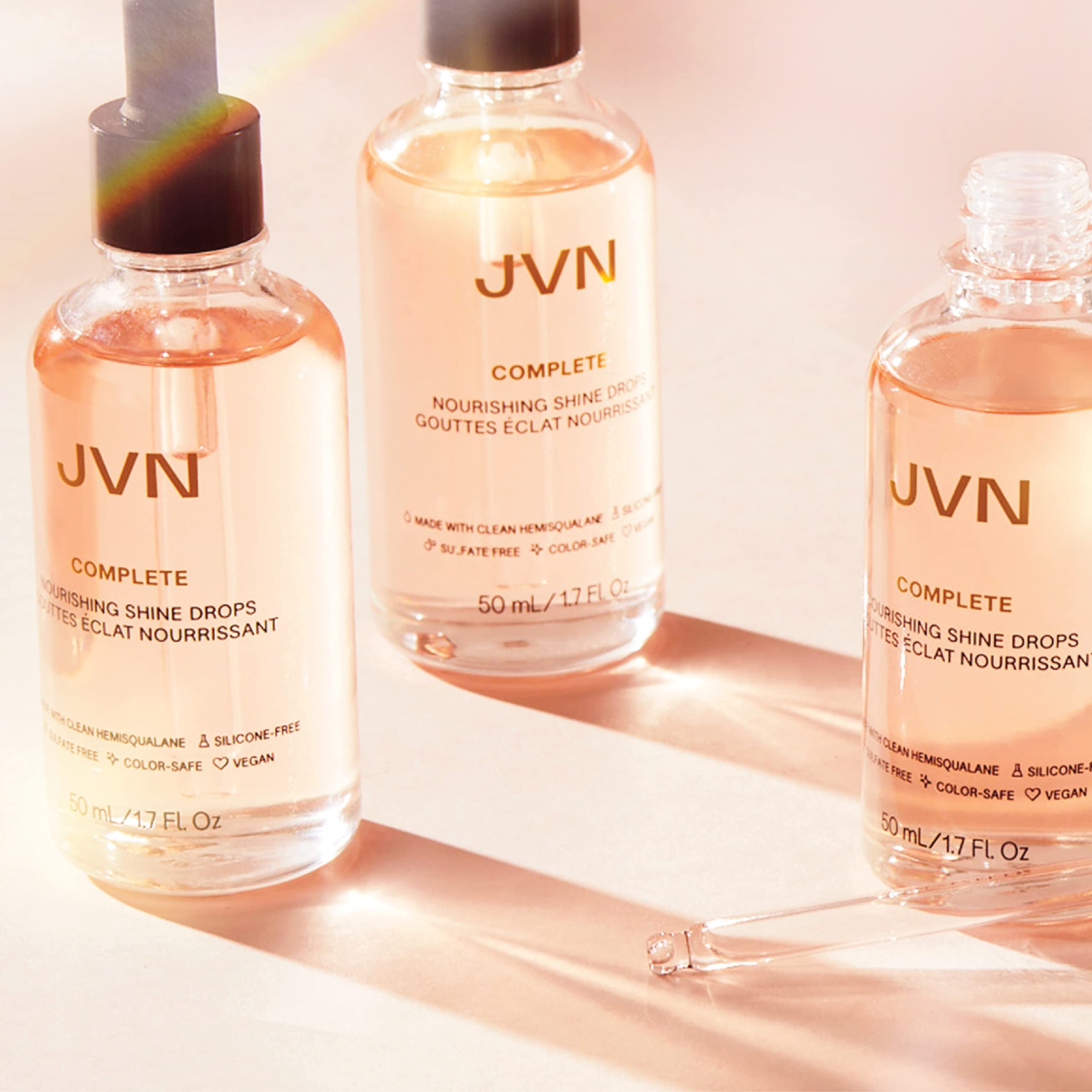 JVN Complete Nourishing Shine Drops on vanity conveys premium, fast-absorbing hair care.
