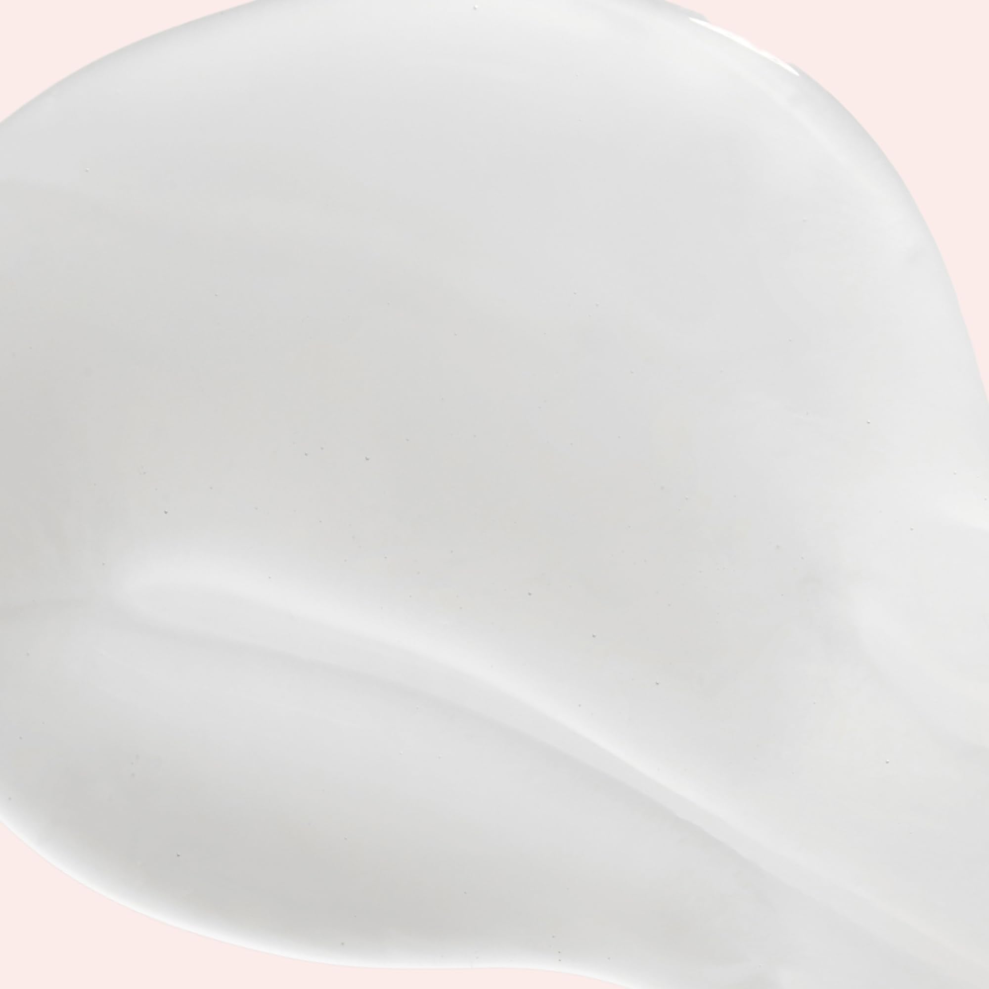 JVN Revive Shampoo on sink shelf conveys premium, salon-inspired repair.