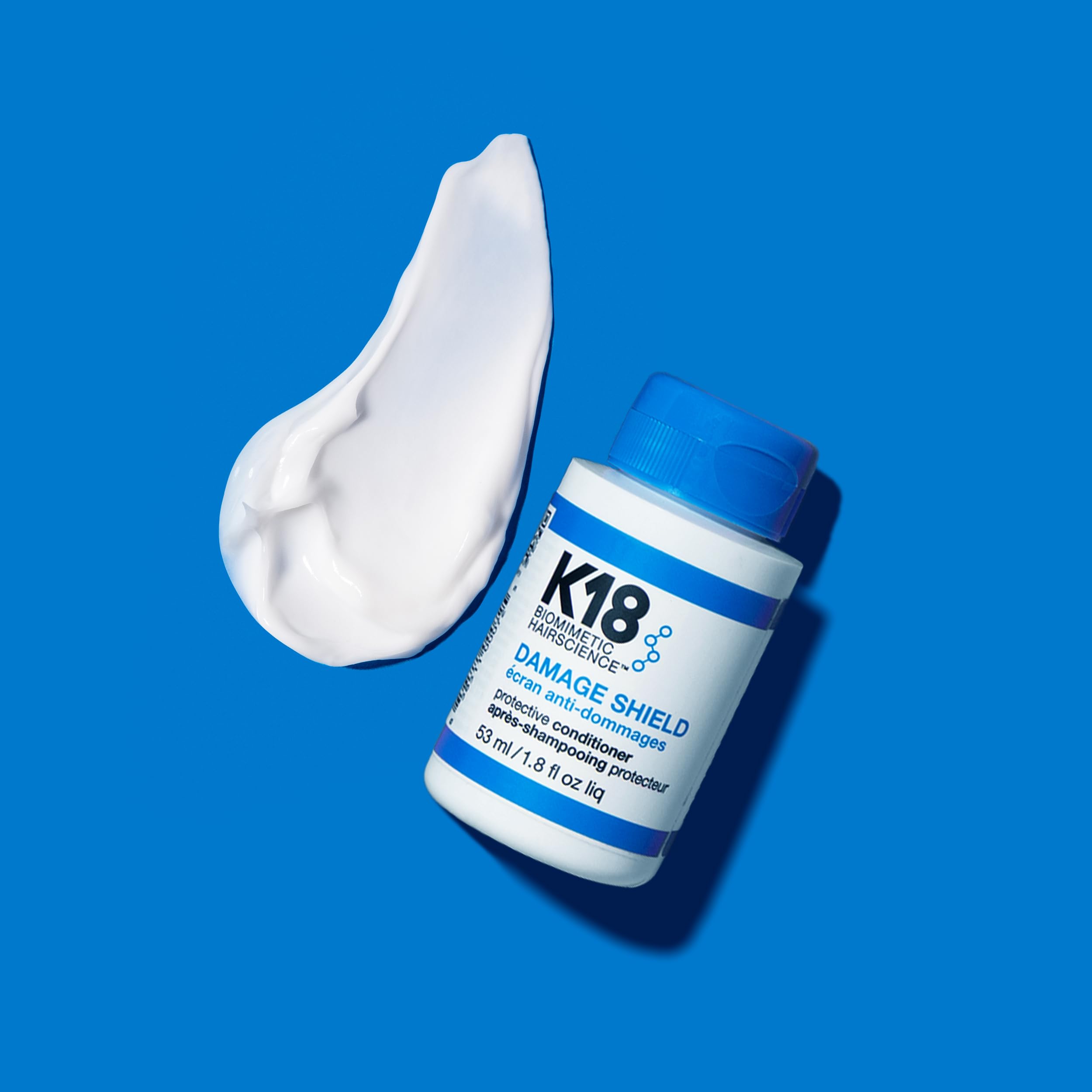 K18 Damage Shield applying on hair for smoothness and strength