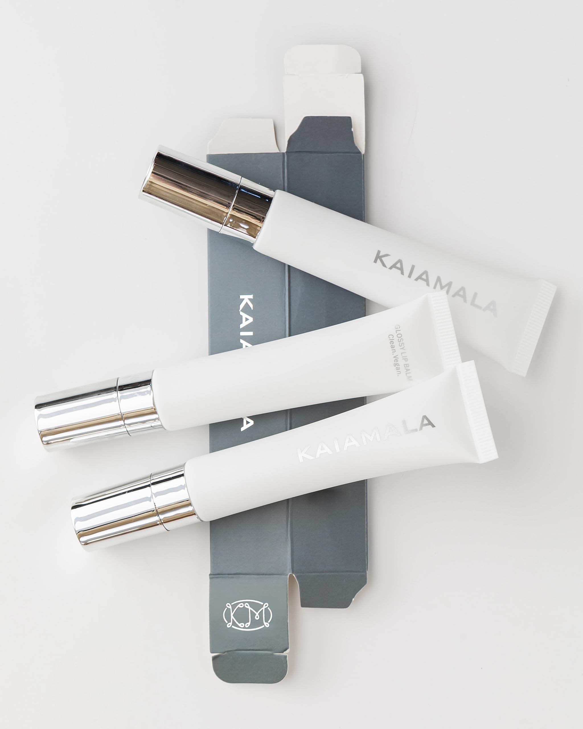 Kaiamala lip balm glide-on application shown for easy on-the-go touchups.