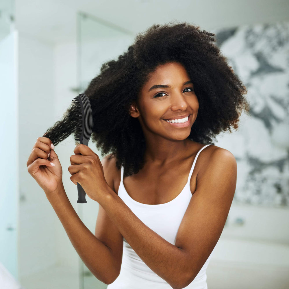 KareCo Tangle Buster Brush smooth glide promotes gentler detangling and reduced breakage.