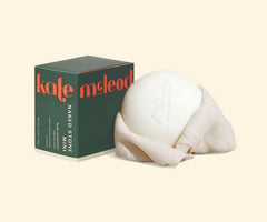 Kate McLeod Naked Stone Mini tin for travel-ready moisturization.