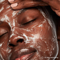 Kate Somerville Exfolikate Cleanser texture closeup with creamy foam and micro-exfoliating particles