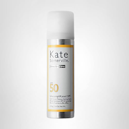 Kate Somerville SPF50 bottle in hand for on-the-go sun protection.