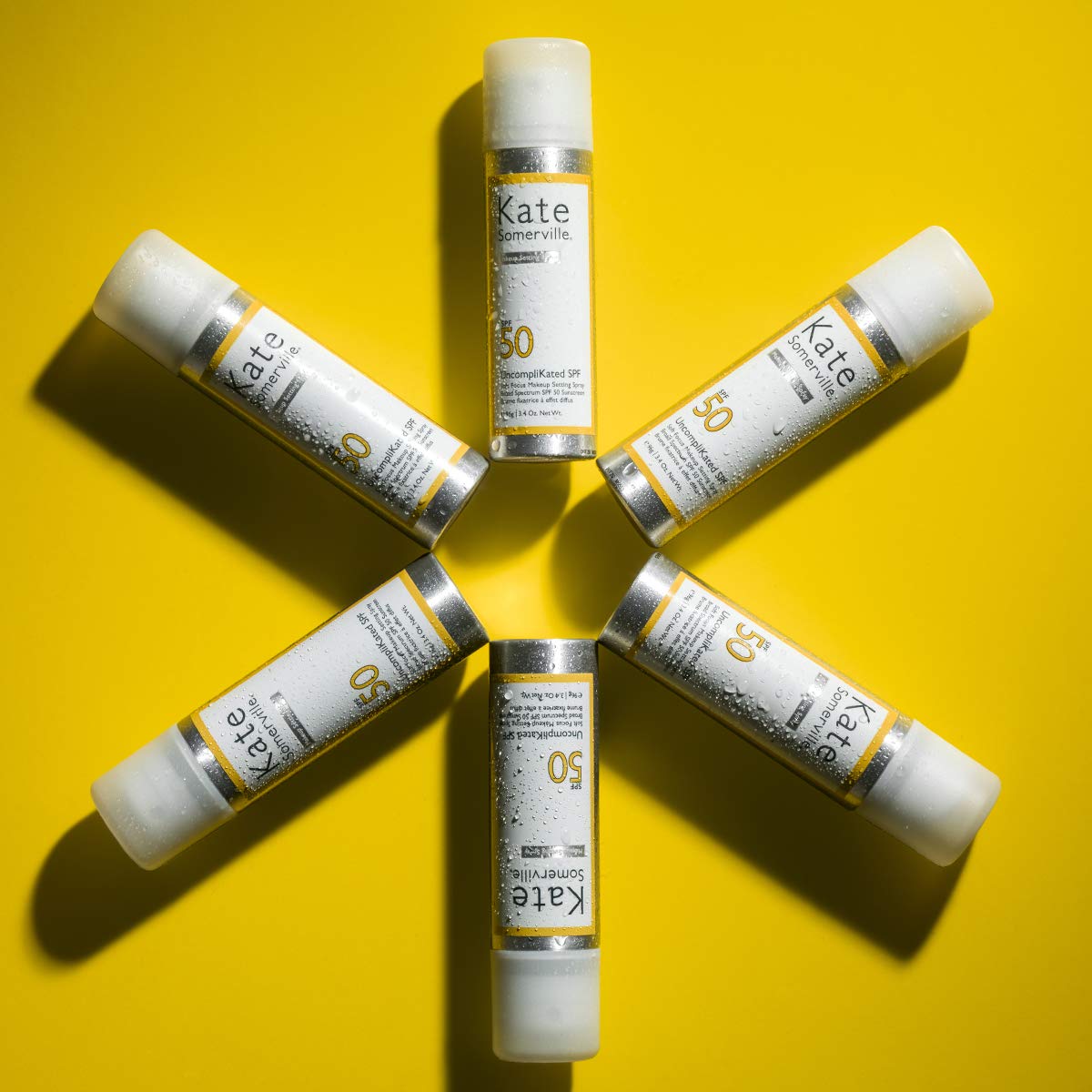 Kate Somerville SPF50 applied to cheek shows even coverage with matte texture.