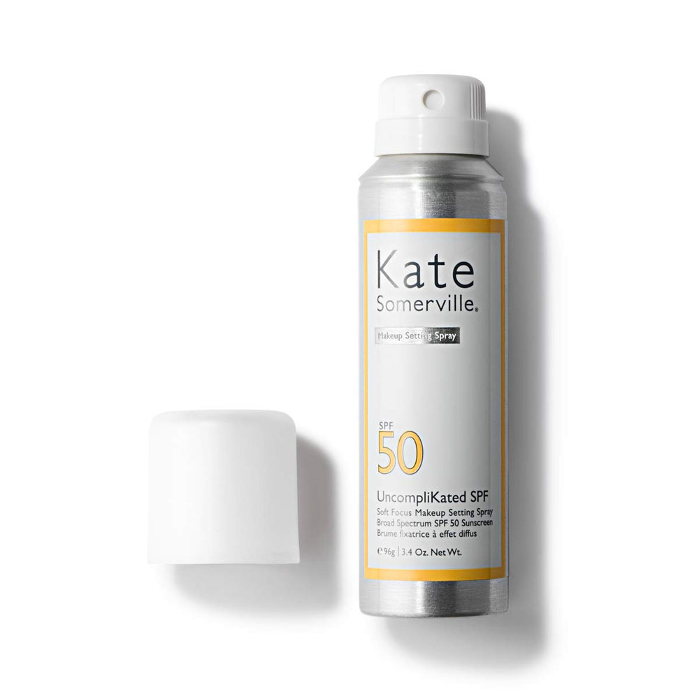 Kate Somerville Uncomplikated SPF50 mist-dispense in action for quick makeup-ready coverage.