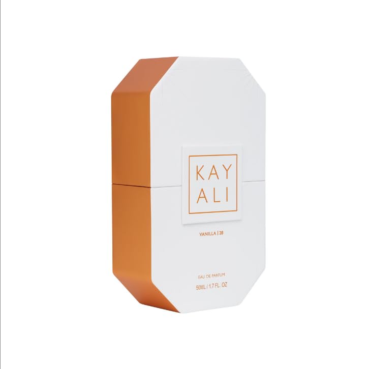 Kayali Vanilla 28 bottle in hand suggests travel-friendly luxury.