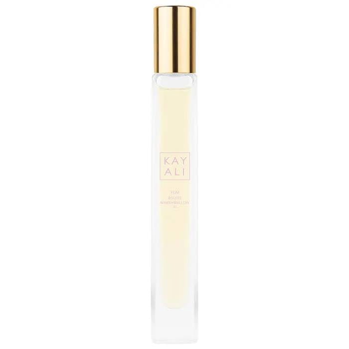 KAYALI Yum Boujee Marshmallow 81 travel spray bottle for on-the-go freshness.