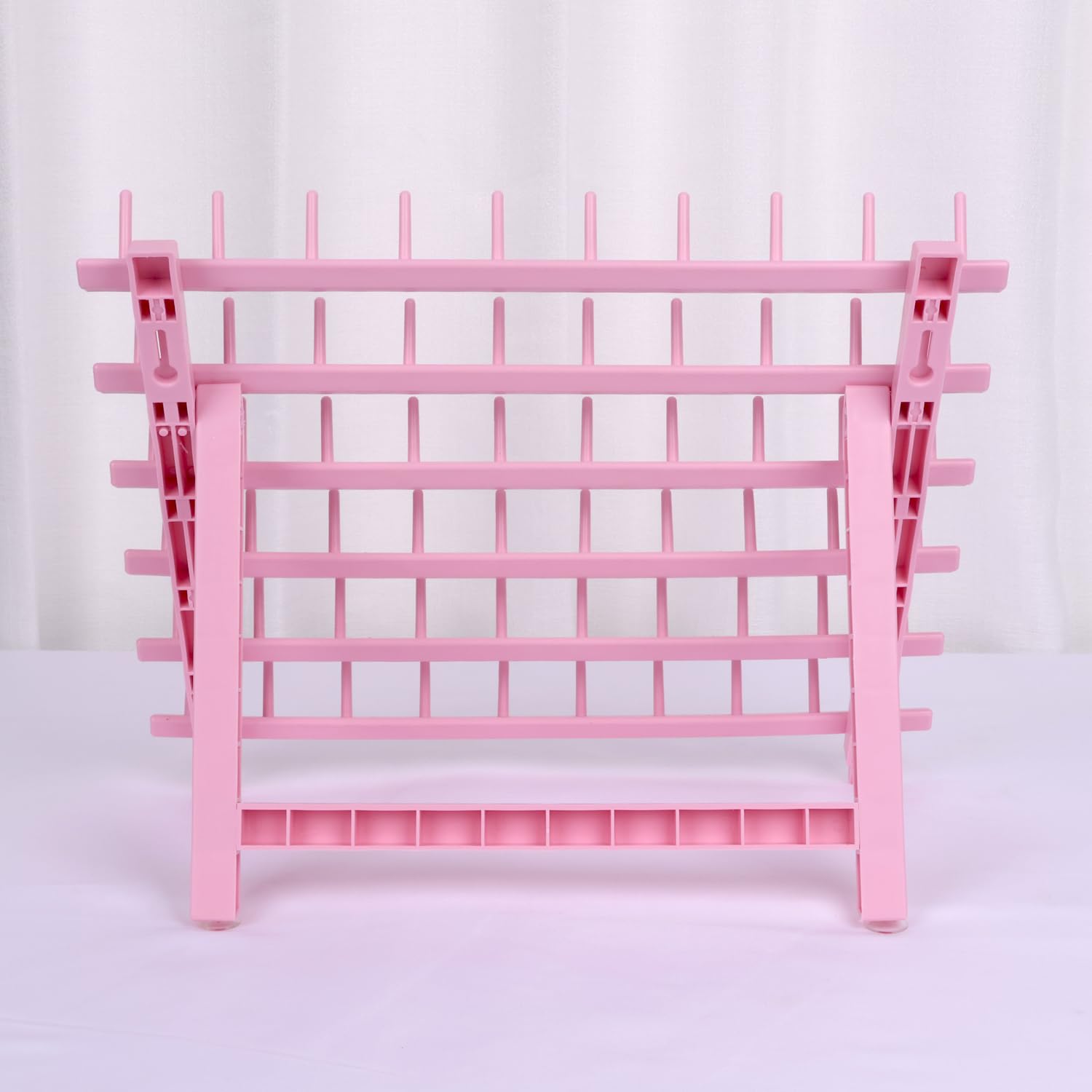 Kelukeya braid rack features light pink color for stylish salon ambience.