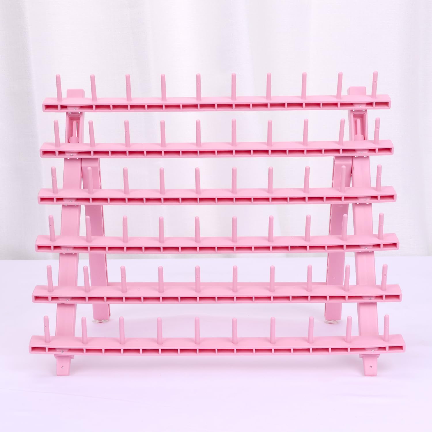 Kelukeya braid rack holds pre-separated hair to speed up braiding.