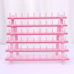 Kelukeya braid rack holds pre-separated hair to speed up braiding.