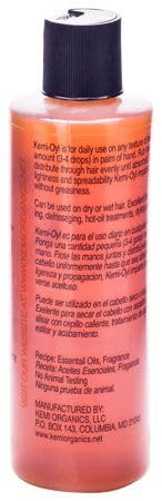 Kemi OYL All Natural Hair Oil label closeup highlighting natural conditioning benefits.