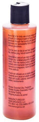 Kemi OYL All Natural Hair Oil label closeup highlighting natural conditioning benefits.