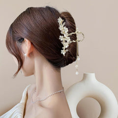 KEMMINTVN crystal-accented lily valley flower enhances a formal hairstyle.