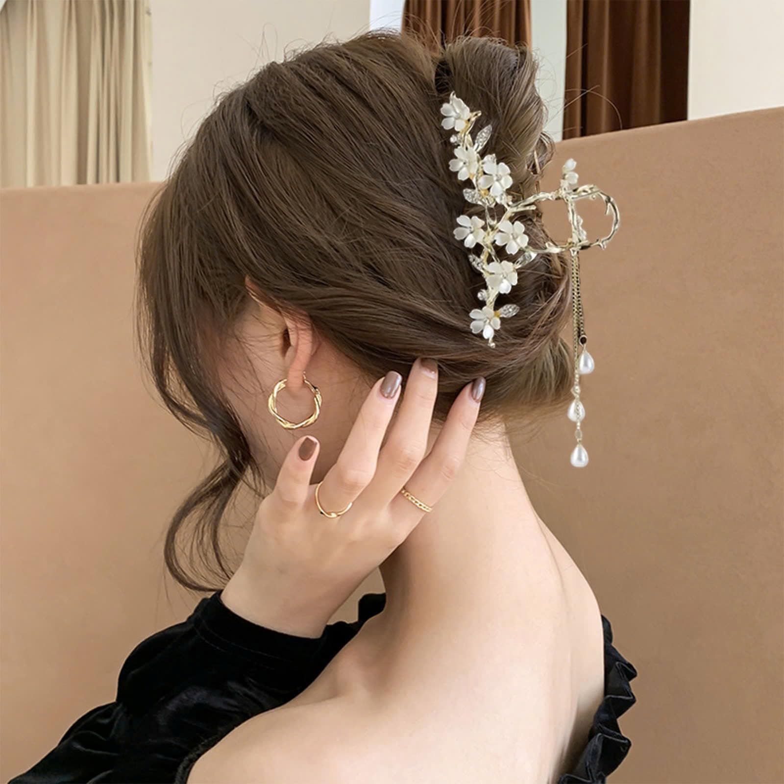 KEMMINTVN dangling pearl drop chains offer graceful movement and shimmer.