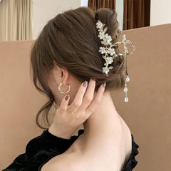 KEMMINTVN dangling pearl drop chains offer graceful movement and shimmer.