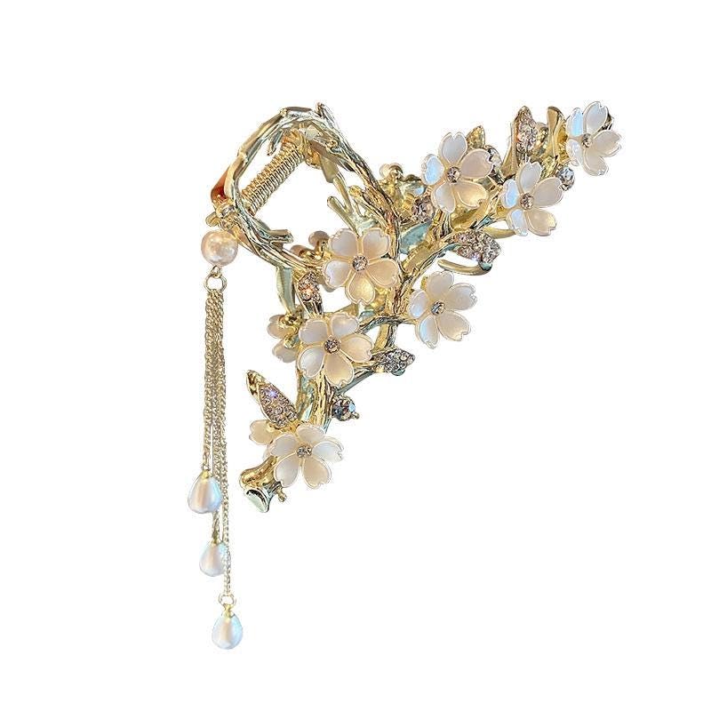 KEMMINTVN elegant floral hair clip with gold Lily of the Valley design secures sophisticated updos.