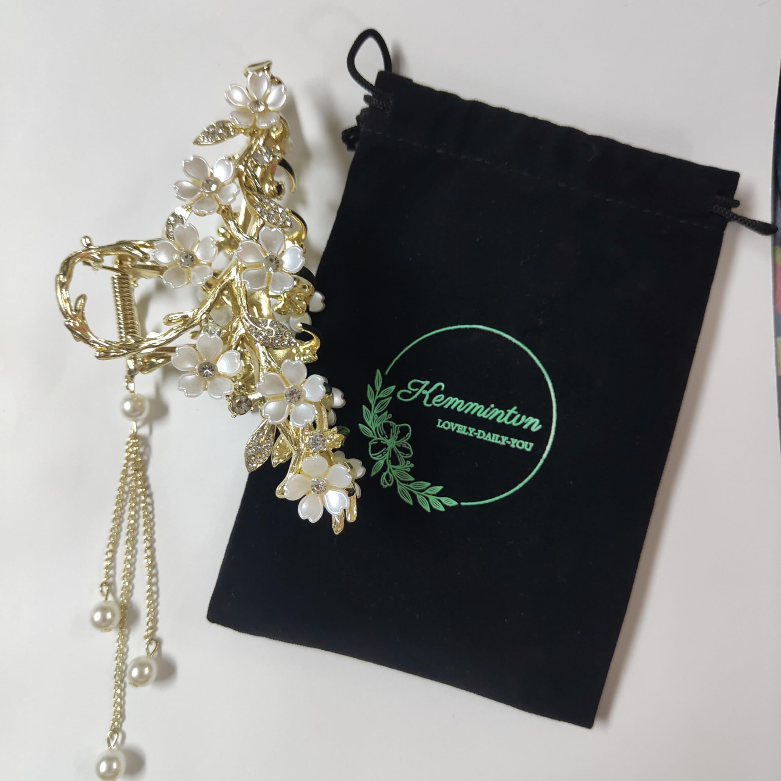 KEMMINTVN pearl tassel bun holder adds dangling pearls for a romantic bun.