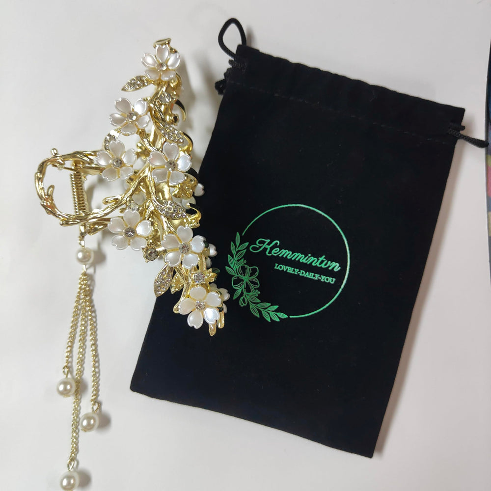 KEMMINTVN pearl tassel bun holder adds dangling pearls for a romantic bun.