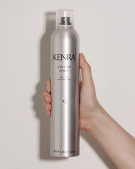 Kenra Volume Spray 25 bottle on model demonstrates all-day natural shine and strong hold.