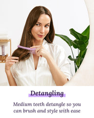 Keranique detangling comb close-up gliding through hair without pulling.