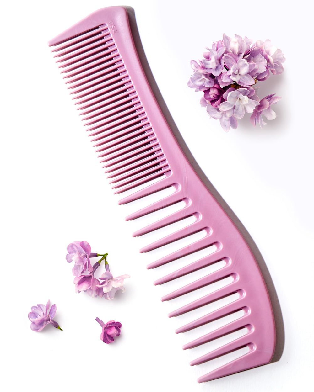 Keranique detangling comb wide-tooth shown for gentle knot removal and even conditioner distribution.