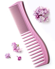 Keranique detangling comb wide-tooth shown for gentle knot removal and even conditioner distribution.
