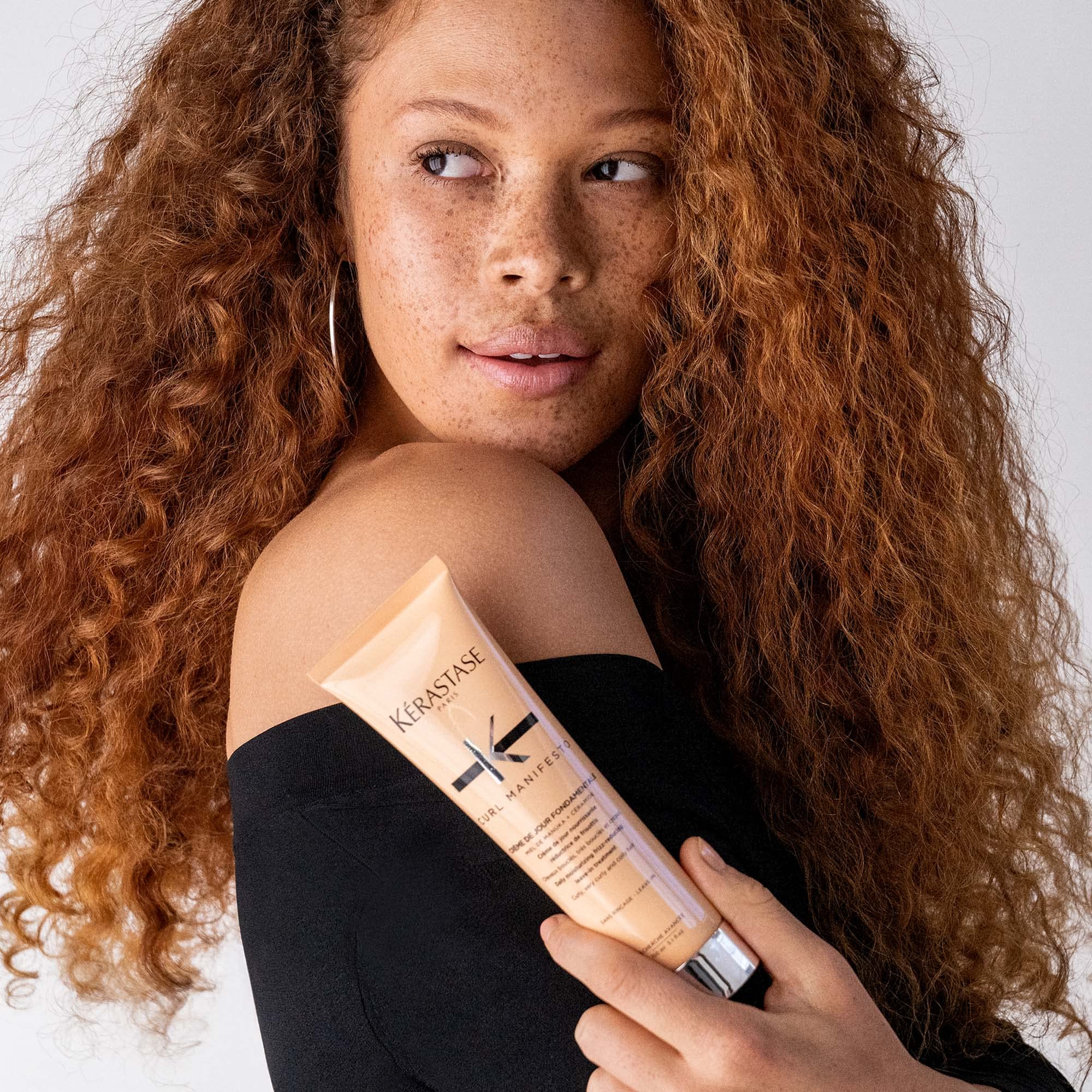 Kerastase Curl Manifesto cream applied from roots to ends for even distribution
