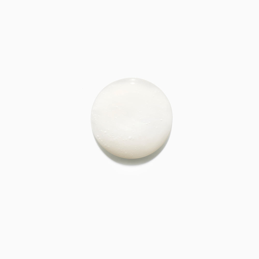 KÉRASTASE Bain Fluidealiste foamy texture image communicates luxurious cleanse for all hair types.