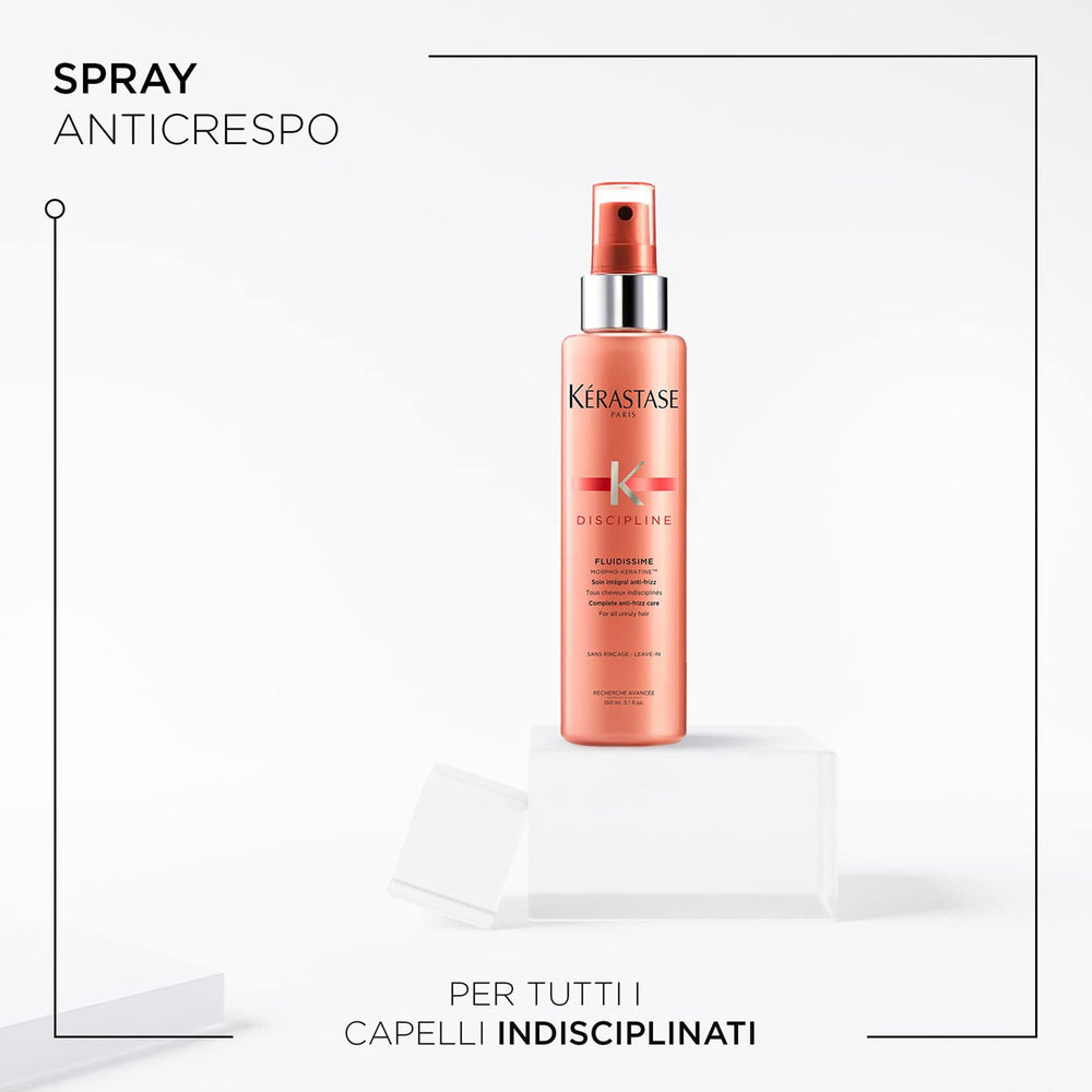 KÉRASTASE Discipline Fluidissime hands applying the mist for smooth, manageable hair.