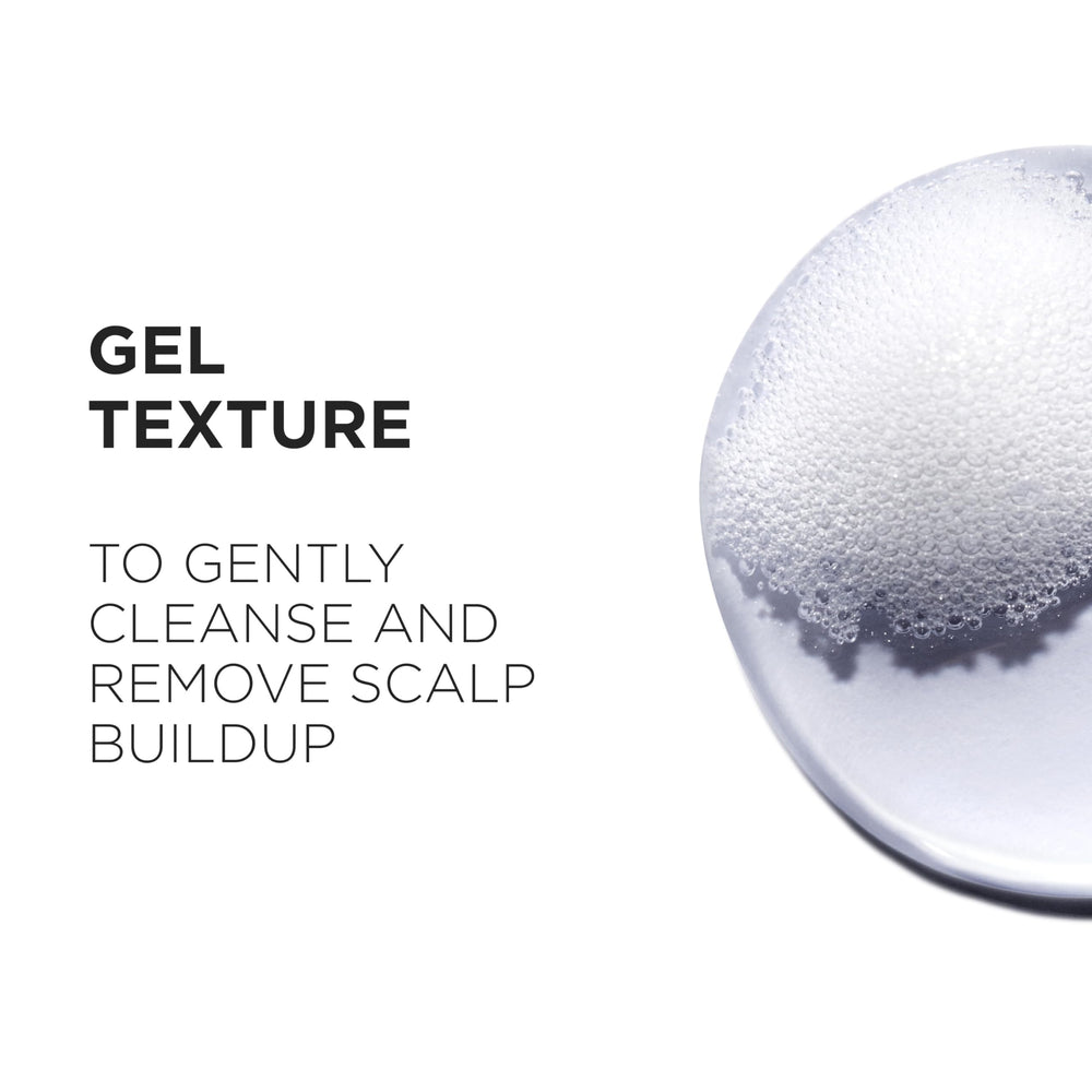 Ginger root imagery on Kerastase Genesis bottle suggesting scalp benefits.
